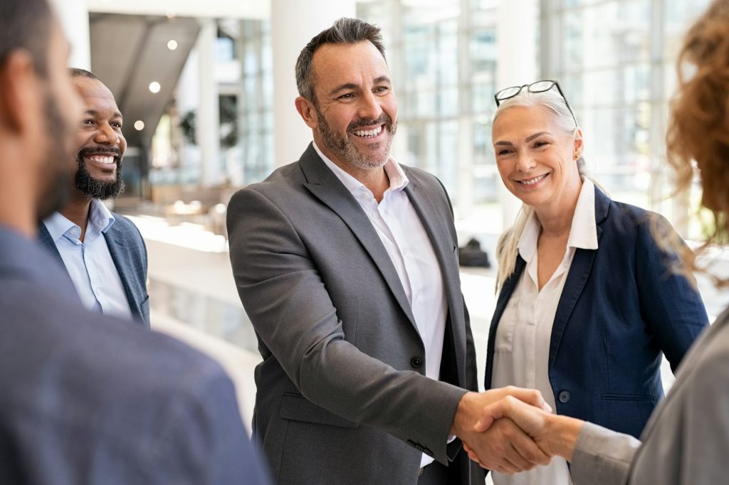 Business people shaking hands in meeting